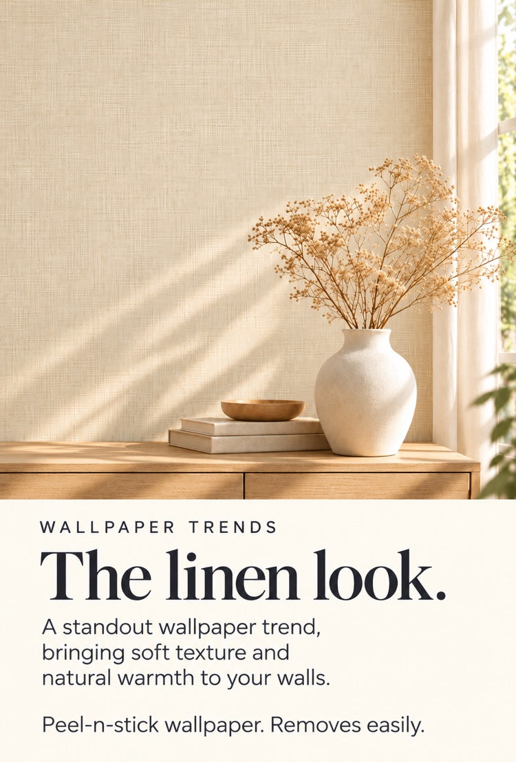 Linen-look peel-and-stick wallpaper behind a vase of dried flowers on a side table